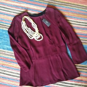 Tibi Burgundy or wine peplum blouse